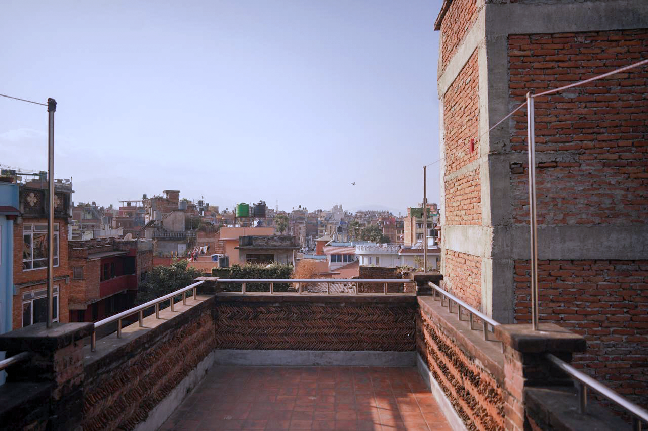 The roof terrace looking over Patan to the Himalaya