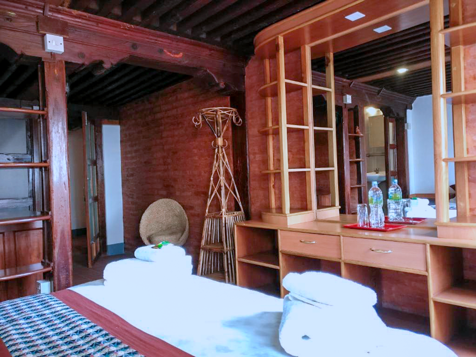Rudrayani dressing table and mirror beside the double bed