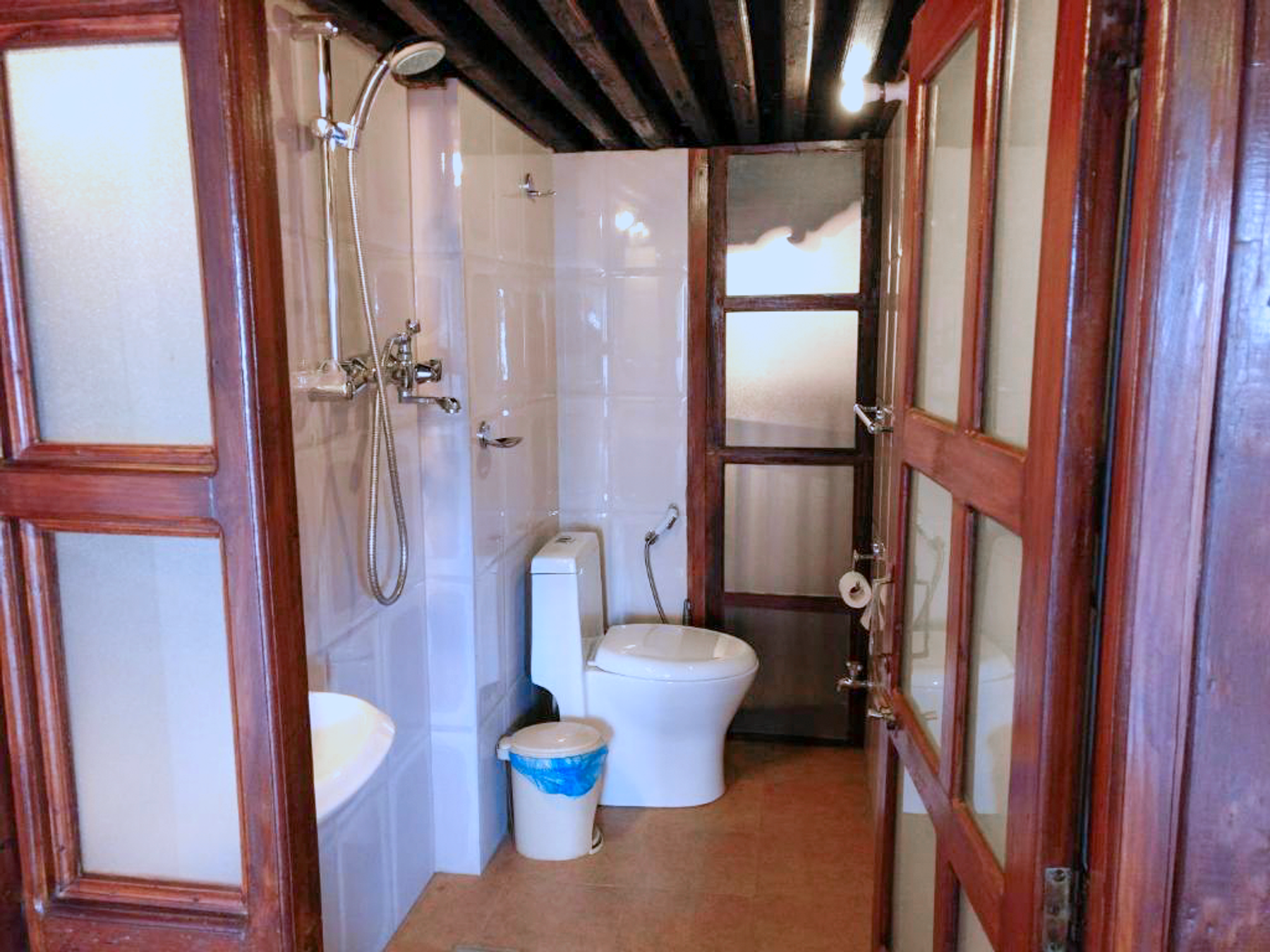 Rudrayani private ensuite bathroom with shower and toilet