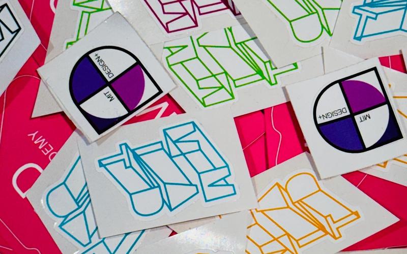 A collection of colorful MAD stickers.