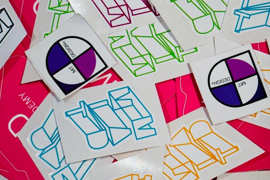 A collection of colorful MAD stickers.