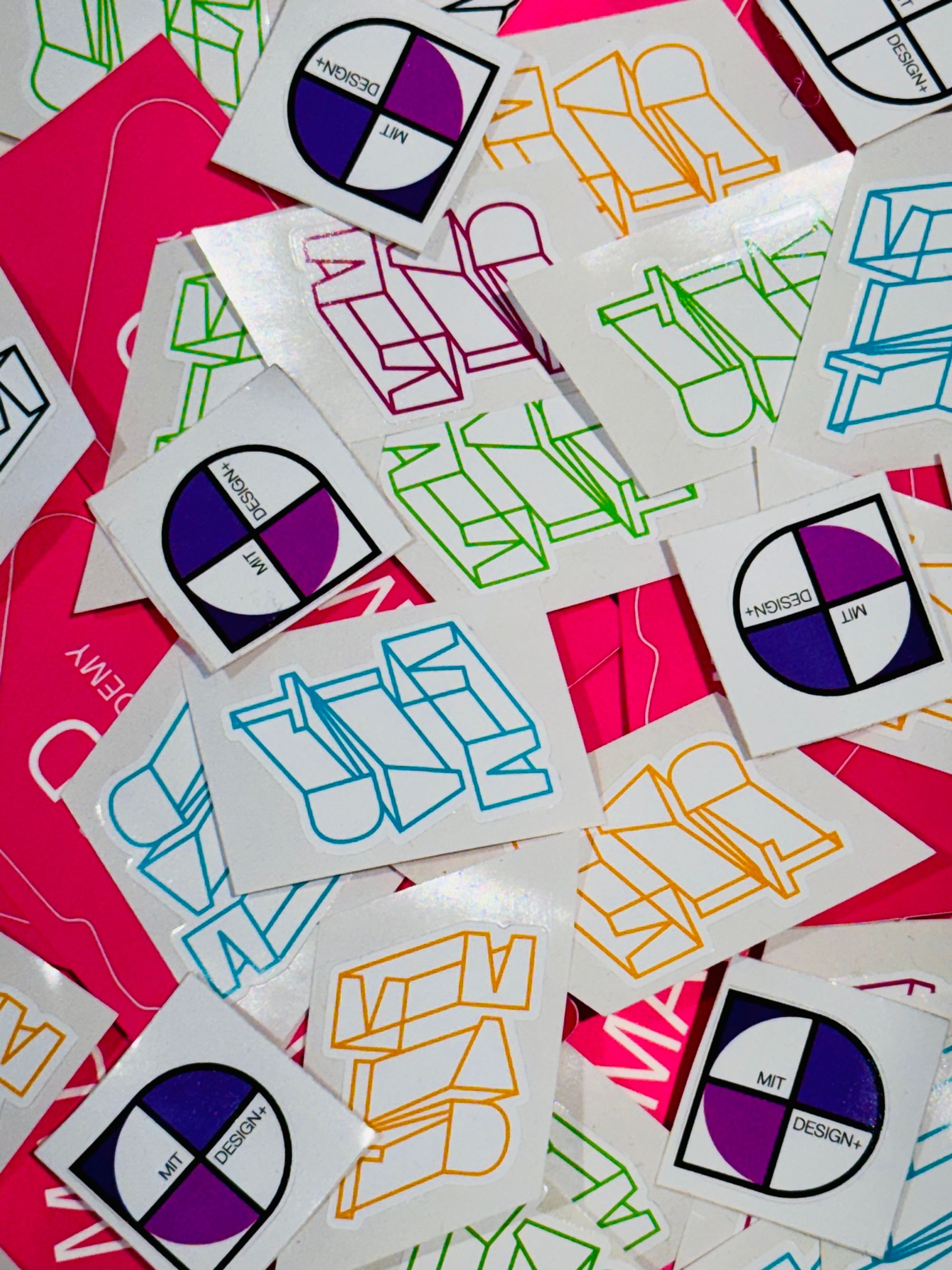 A collection of colorful MAD stickers.