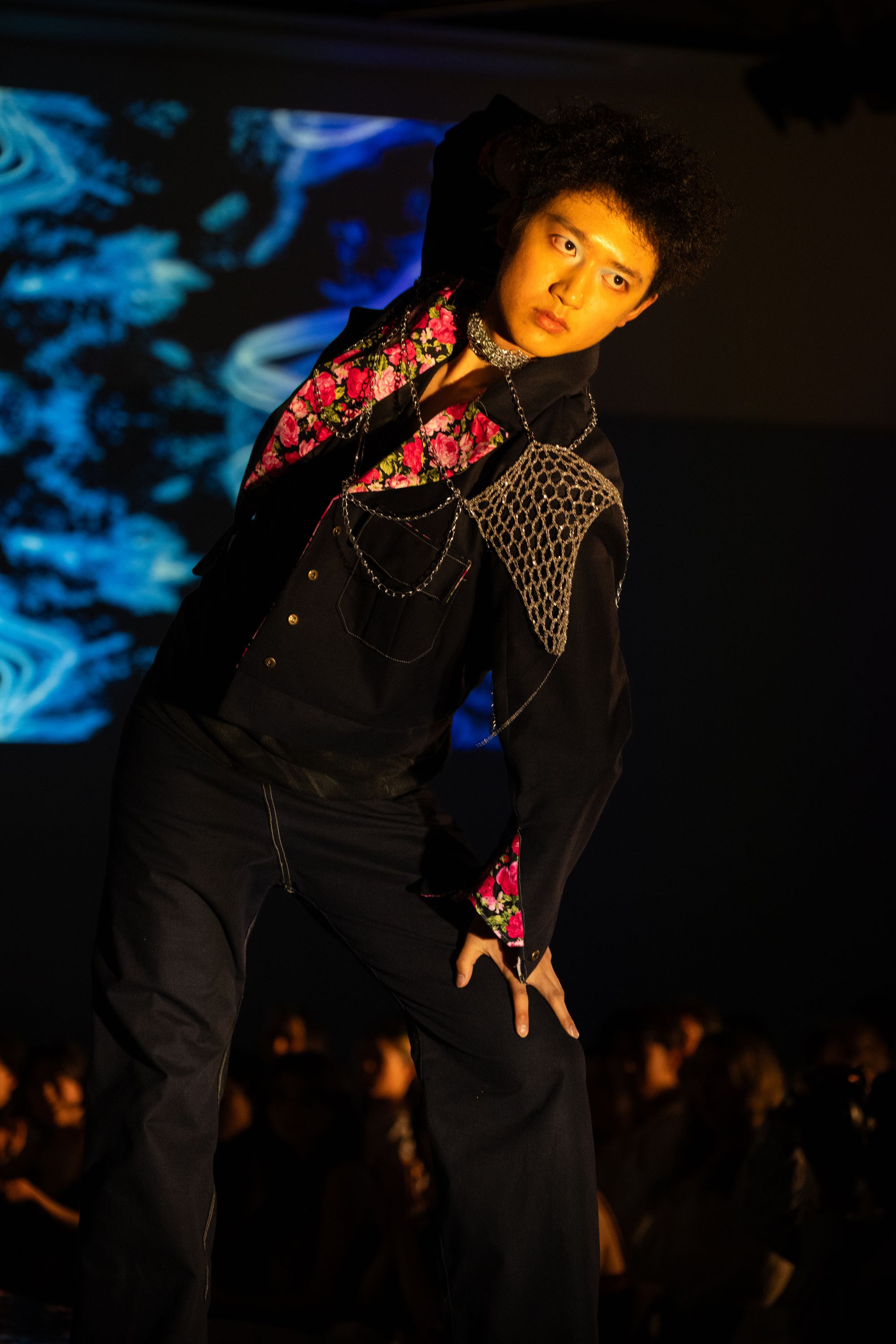 Designed and modeled by Lawrence Liu ‘26, “The True Cost” is a selvedge denim jacket with floral detailing and crocheted metal wire shoulder pads: “Using thin jewelry chain, Phoebe was able to crochet the wire just as she would yarn, producing an intricate web-like shoulder pad.” Photo: Jules Dail