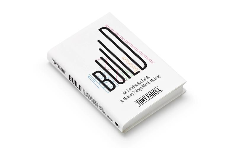 Hardcover book titled "Build: An Unorthodox Guide to Making Things Worth Making" by Tony Fadell. The white cover features the word “BUILD” in large black letters, overlaid with colorful schematic and stitched patterns. The book is shown angled on a white background.