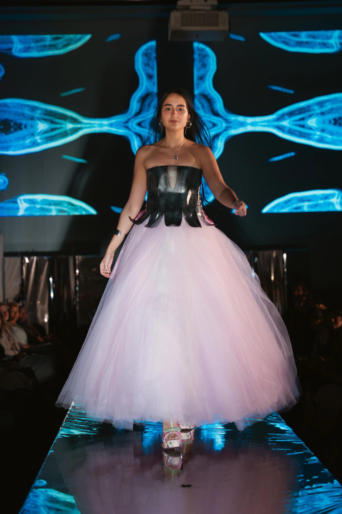 Petal to the Metal self-modeled by Eleni Morales is a "hand-forged and welded metal corset inspired by the shape of an upside-down bellflower adorned with a 15-layered pink tulle skirt." Photo: Michelle Xiang