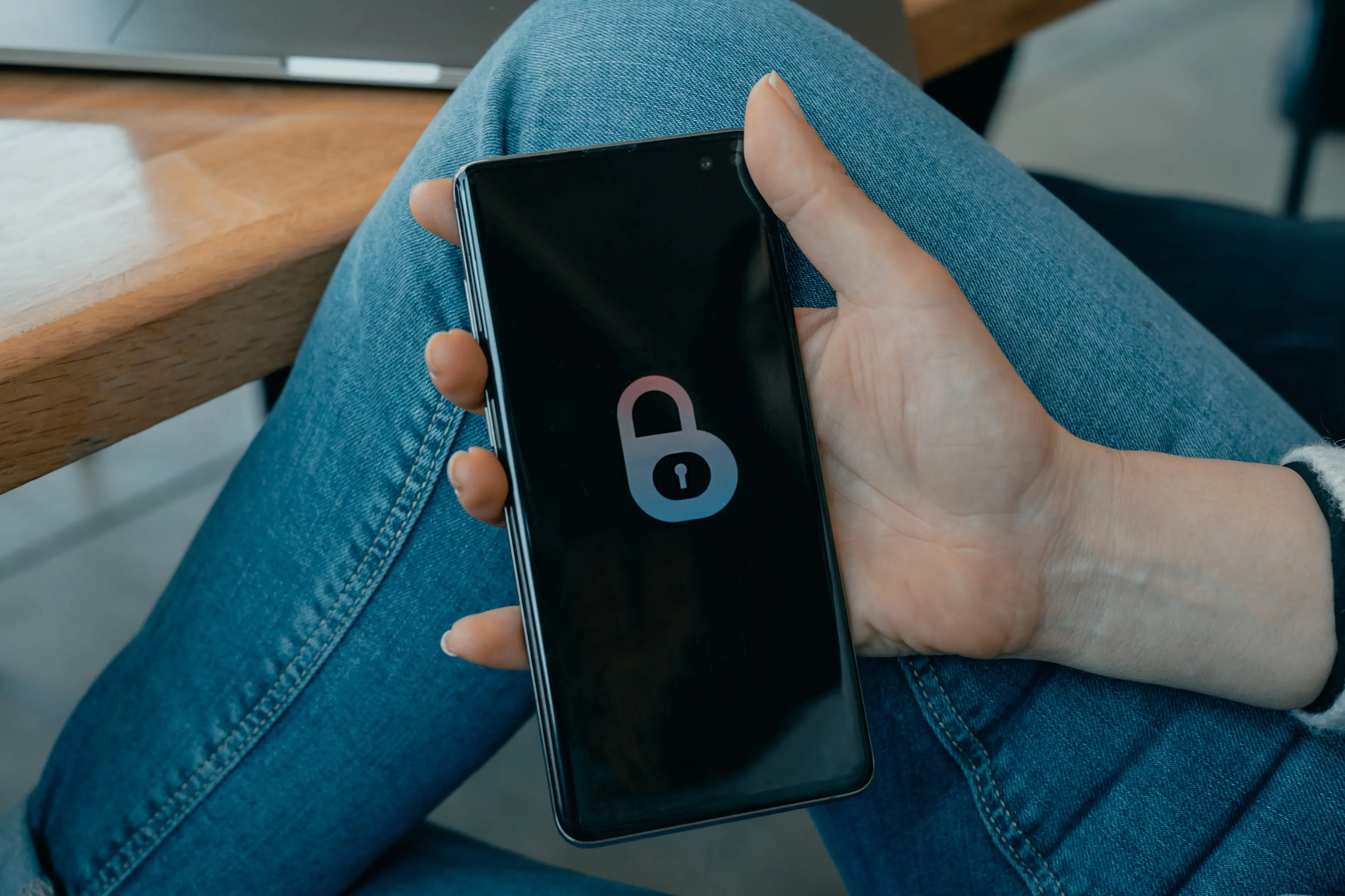 Graphic featuring a mobile phone with a blockchain security icon