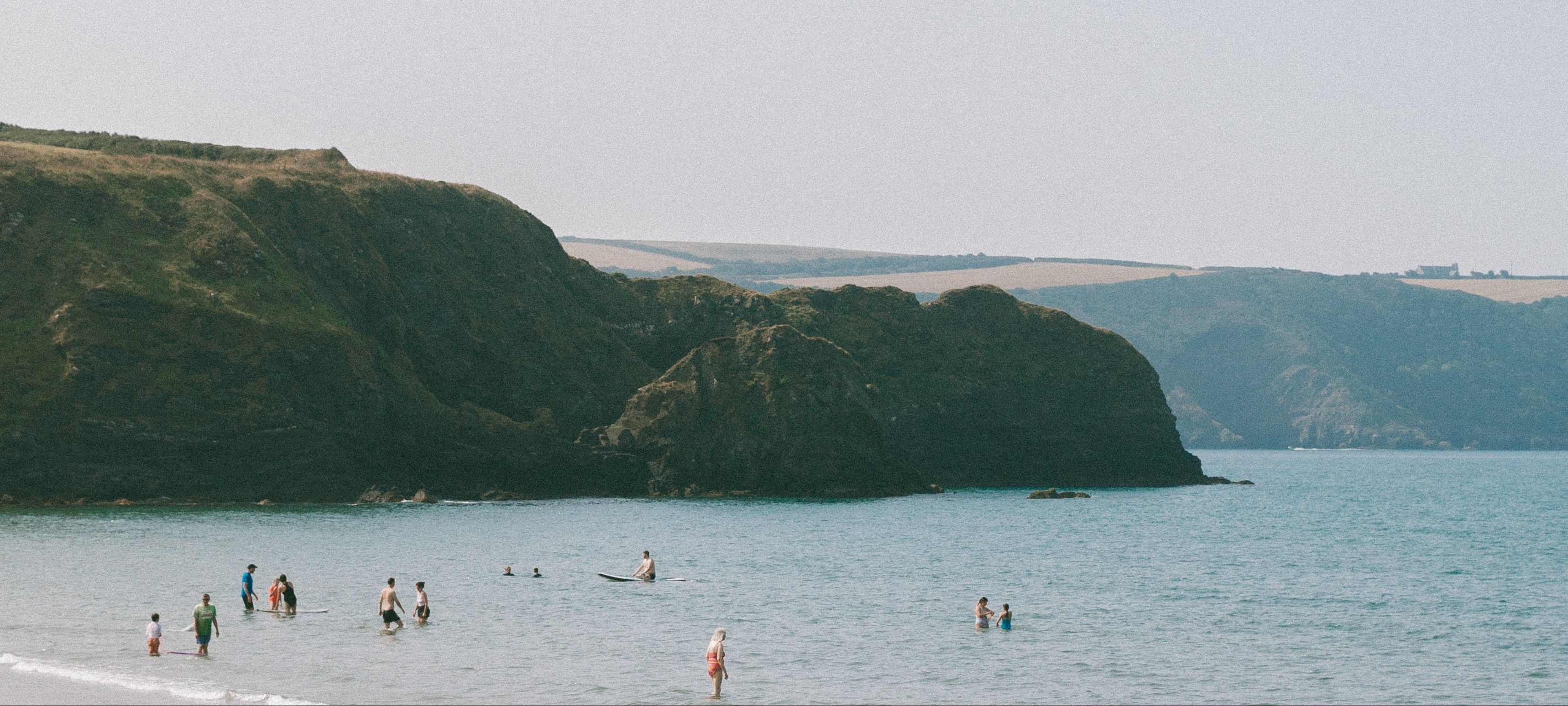 Rwts logo over an image of the beach