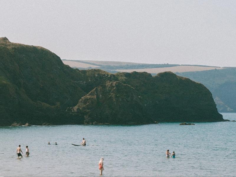 Rwts logo over an image of the beach