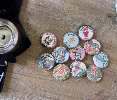 Some of the one-of-kind buttons that were made special for this event. The buttons feature a variety of friendly animals coupled with resistance fists and slogans.