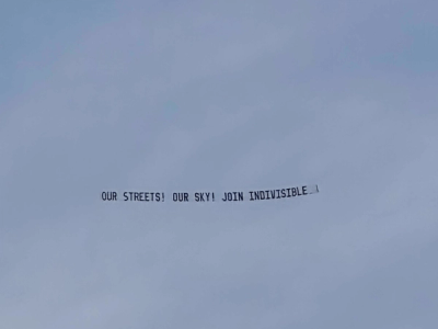 Sky Indivisible flew an aerial billboard over Detroit's No King's rally. The banner answers the question, 'WHOSE STREETS?'