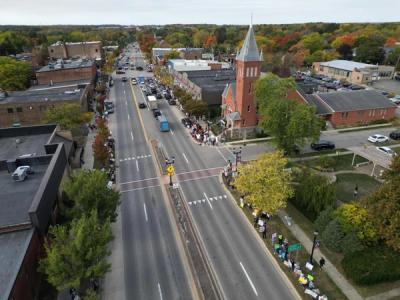 Eastwardly-facing drone image showing peaceful protesters stretched far down Michigan Ave