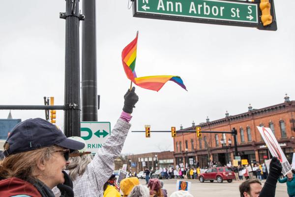 Pride flag flying at the April 5, 2025 Hands-Off protest in Saline Michigan.