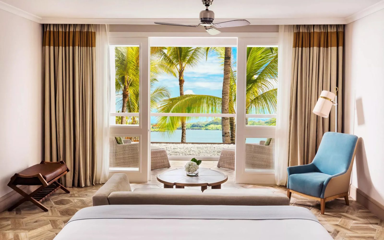 The Lagoon Room with a king size bed and balcony overlooking the ocean