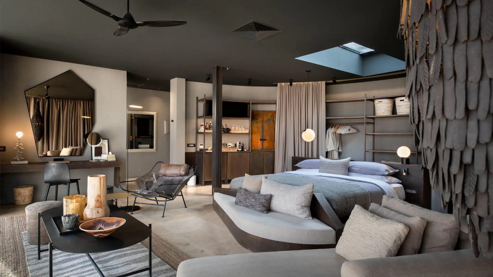 A sophisticated, modern desert suite featuring a stargazing skylight