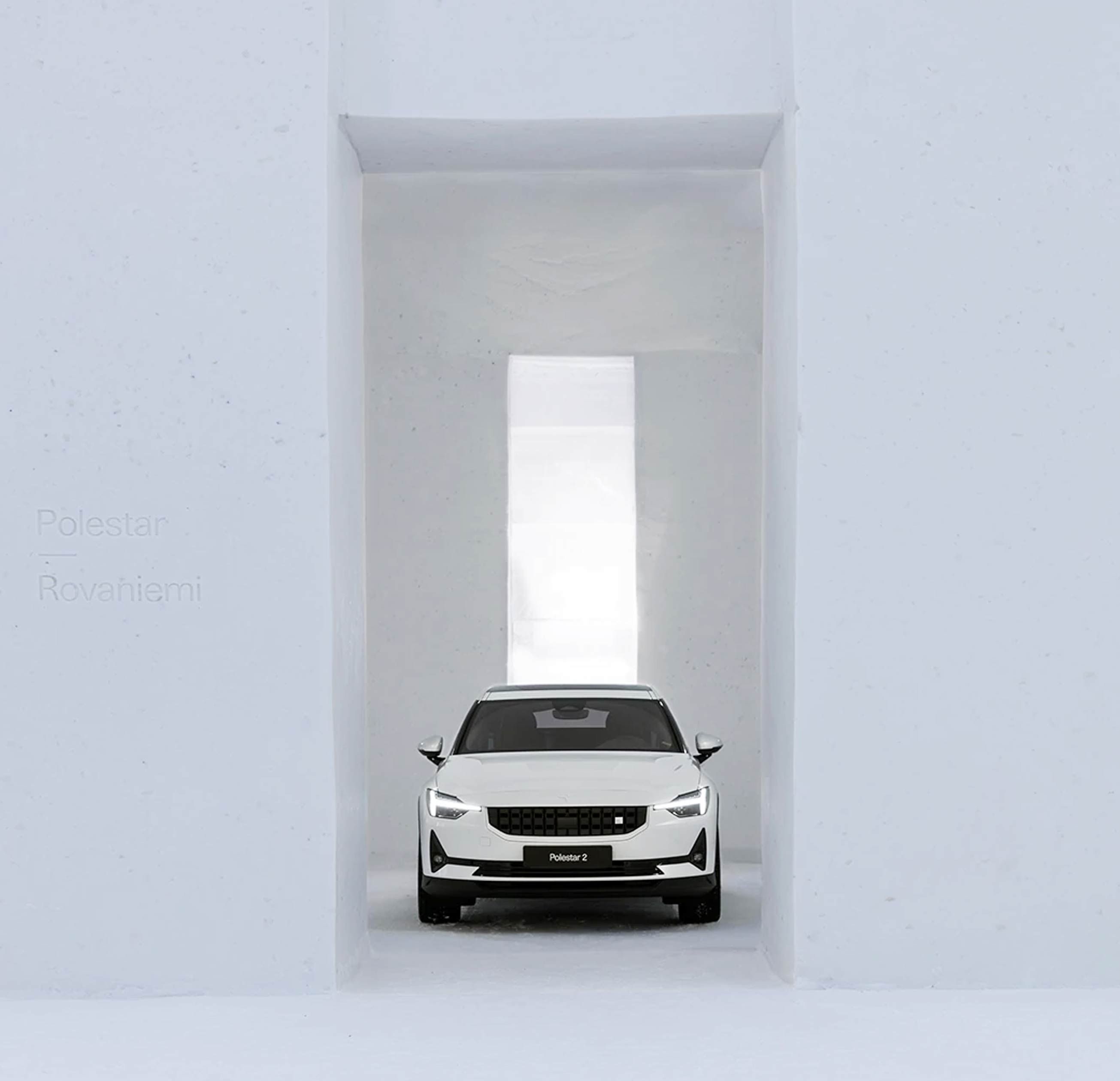 White Polestar 2 car inside a gigantic showroom entirely made of snow