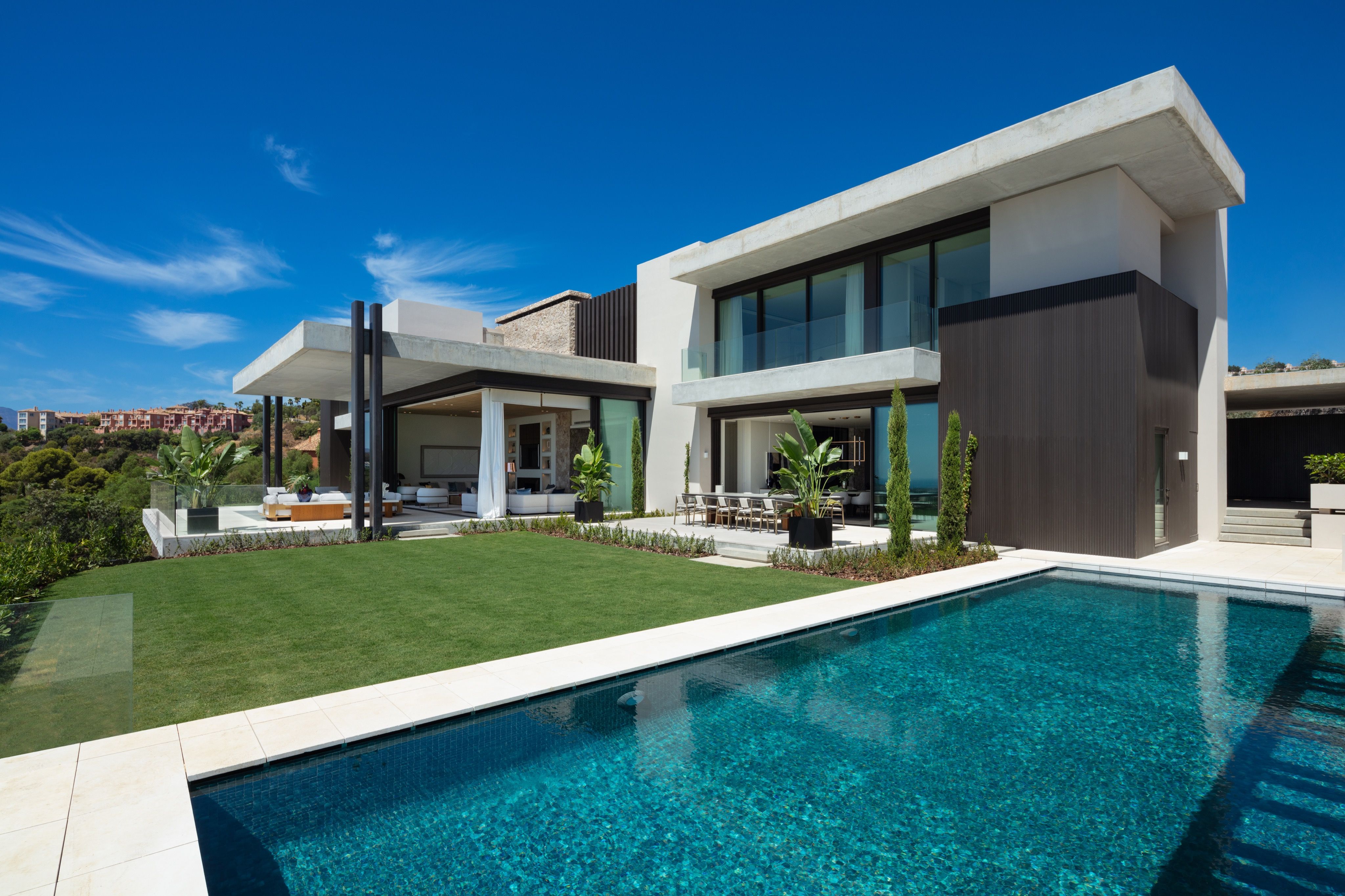 Daytime exterior of The Hills 8 with swimming pool and modern villa facade