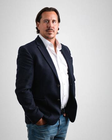 Portrait of Jack Ballantine, a Golf Homes International team member.