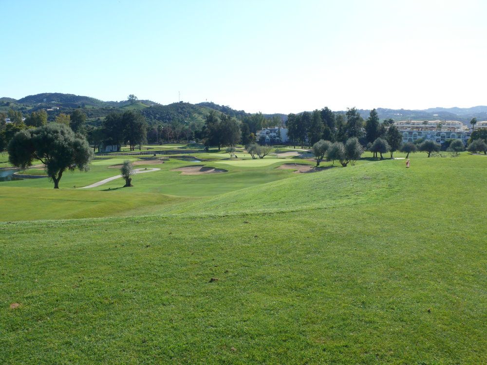 Tree-lined fairway and bunkers at Mijas Golf Los Olivos