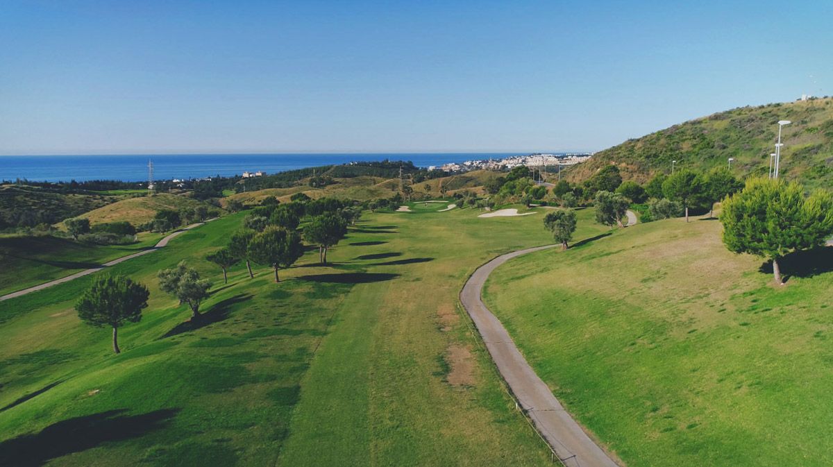 Elevated fairways at Cerrado del Águila Golf & Resort with the Mediterranean beyond