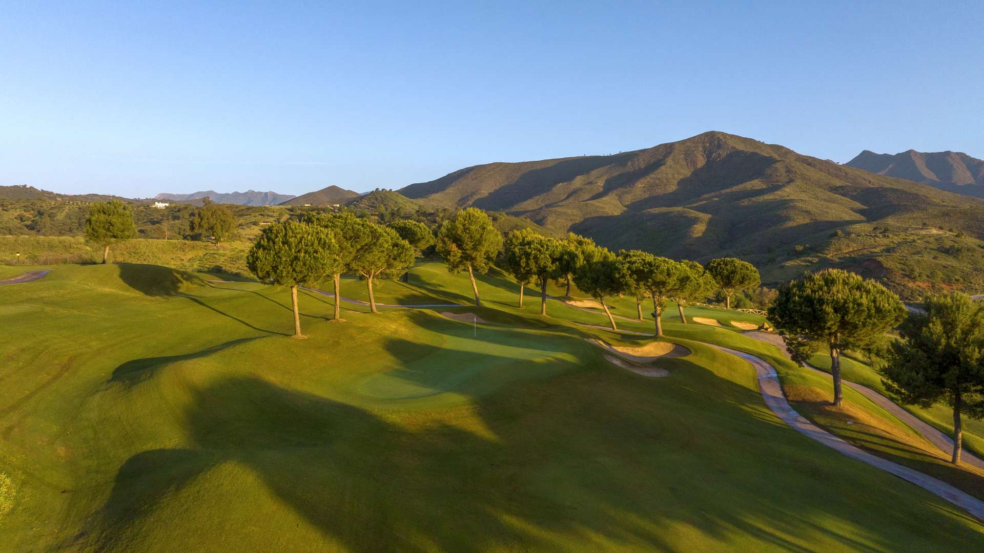 Elevated fairway on La Cala Resort Campo America with the Sierra de Mijas beyond