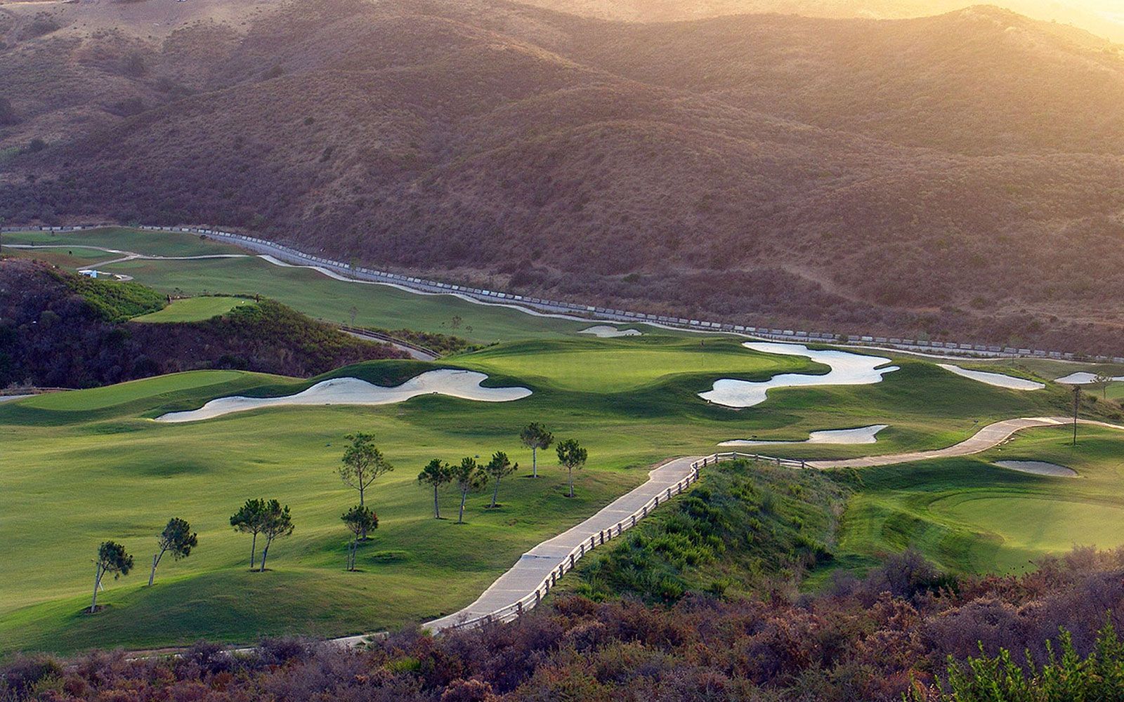Elevated view across fairways and bunkers at Calanova Golf Club