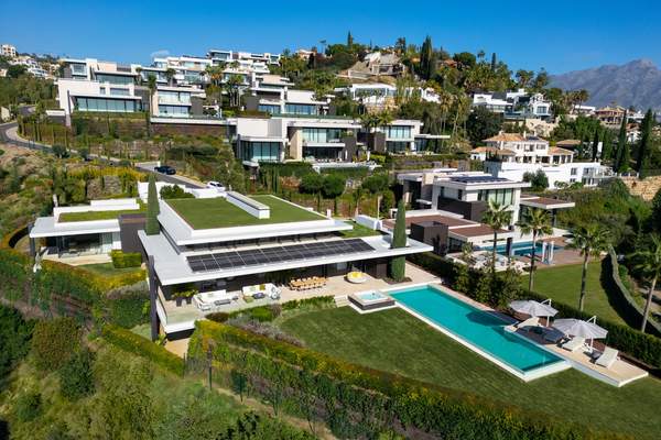Aerial view of The Hills 1 villa, private pool and surrounding La Quinta hillside homes.