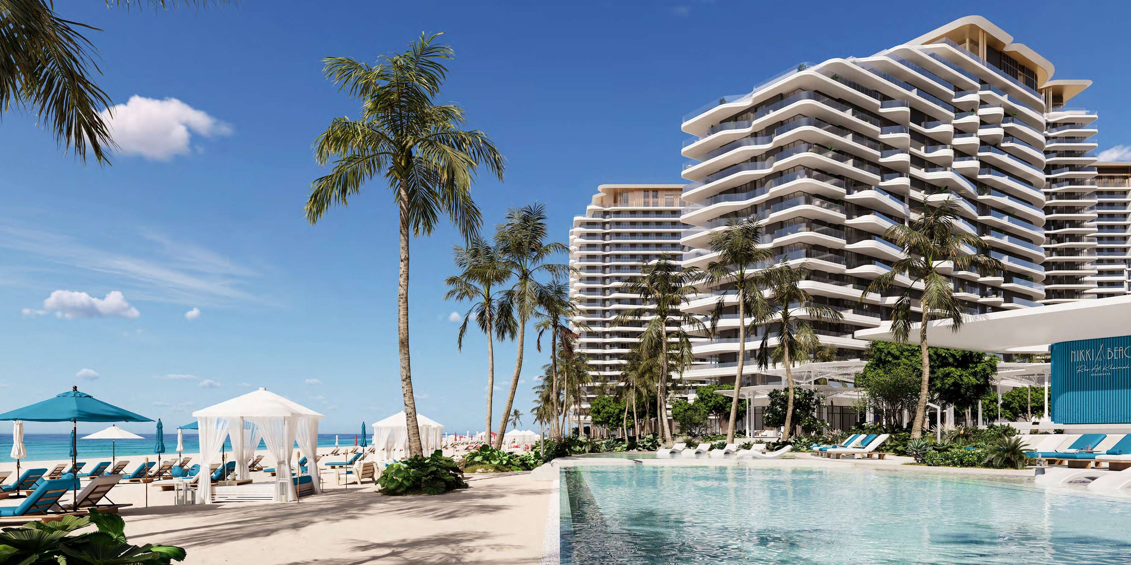 Artist's rendering of Nikki Beach Residences rising above the beach, landscaped pool and palm-lined resort