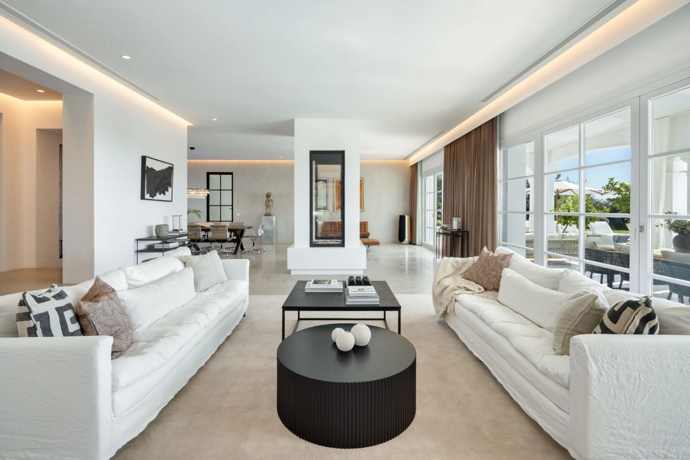 Open-plan living room at Villa Marbella with terrace views