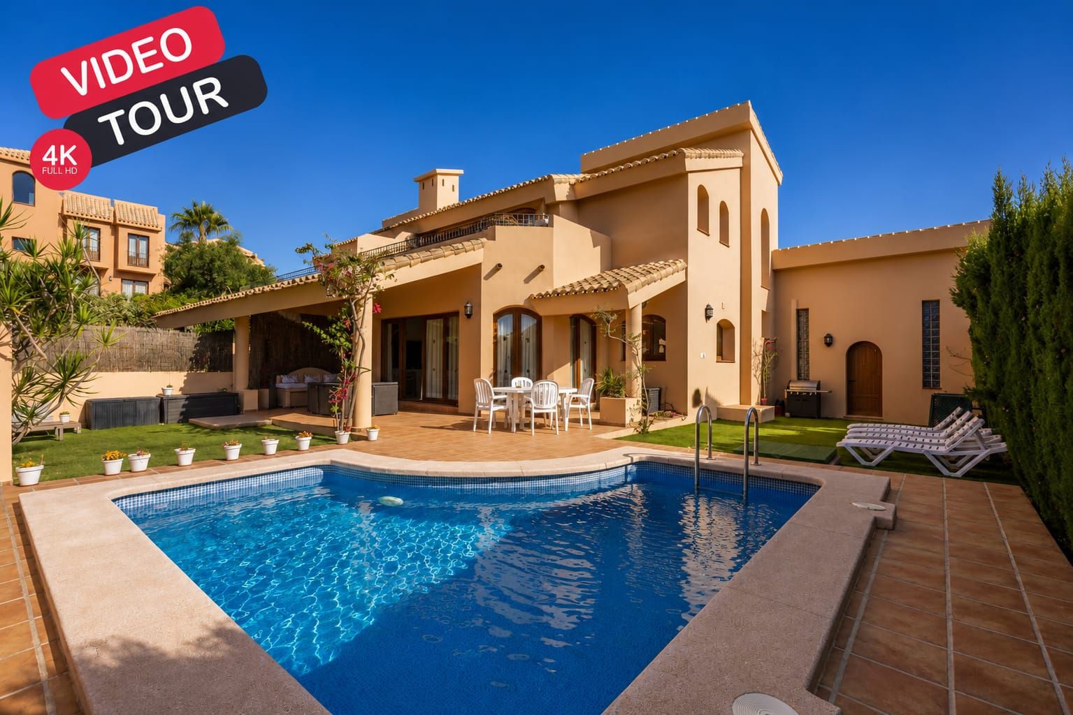 Villa exterior and private pool viewed from the garden