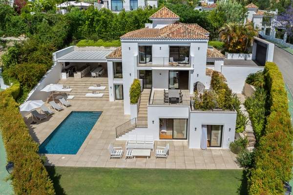 Near-symmetrical elevated overview of the full garden elevation and plot; retain with aerial privacy review