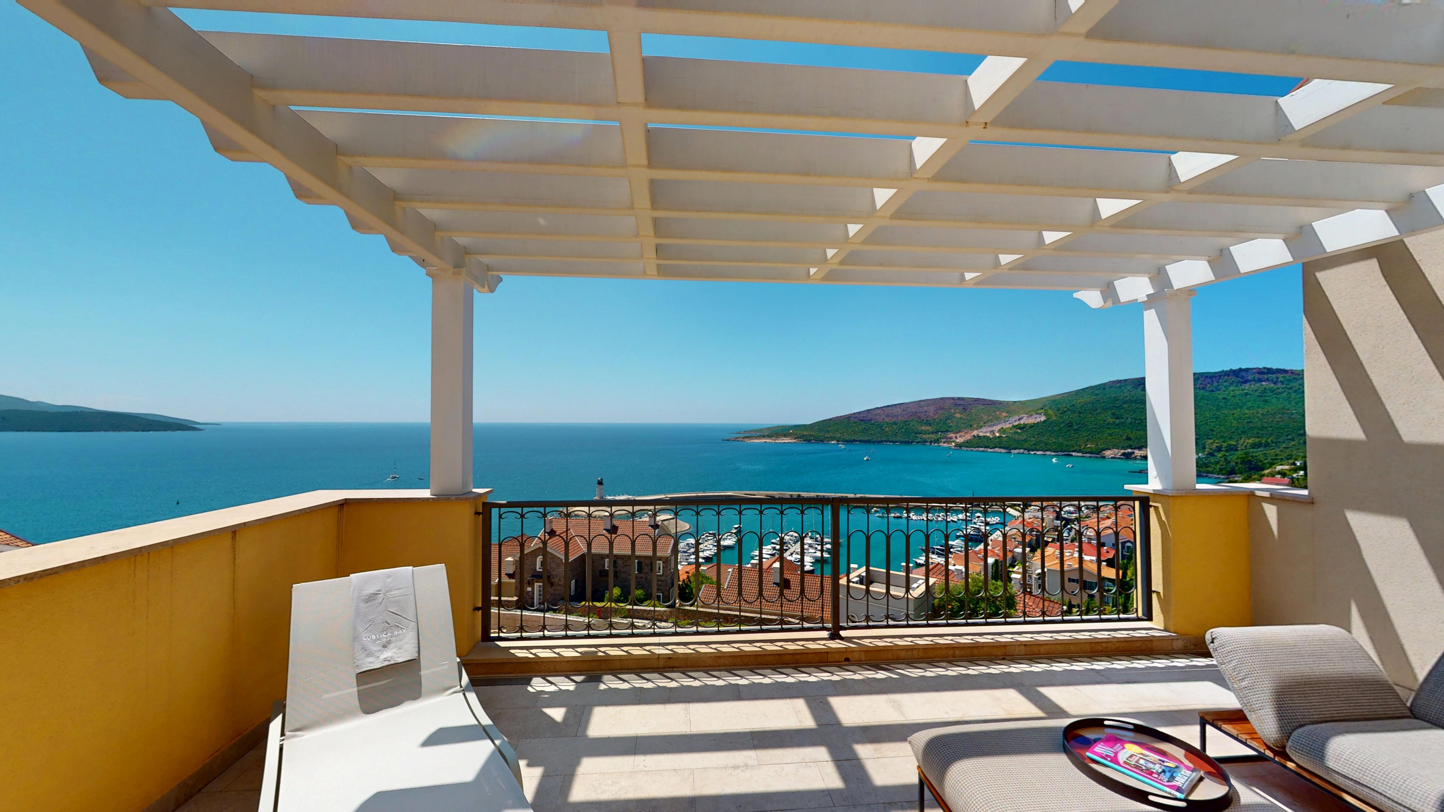 Covered terrace with Marina Village rooftops and the bay beyond