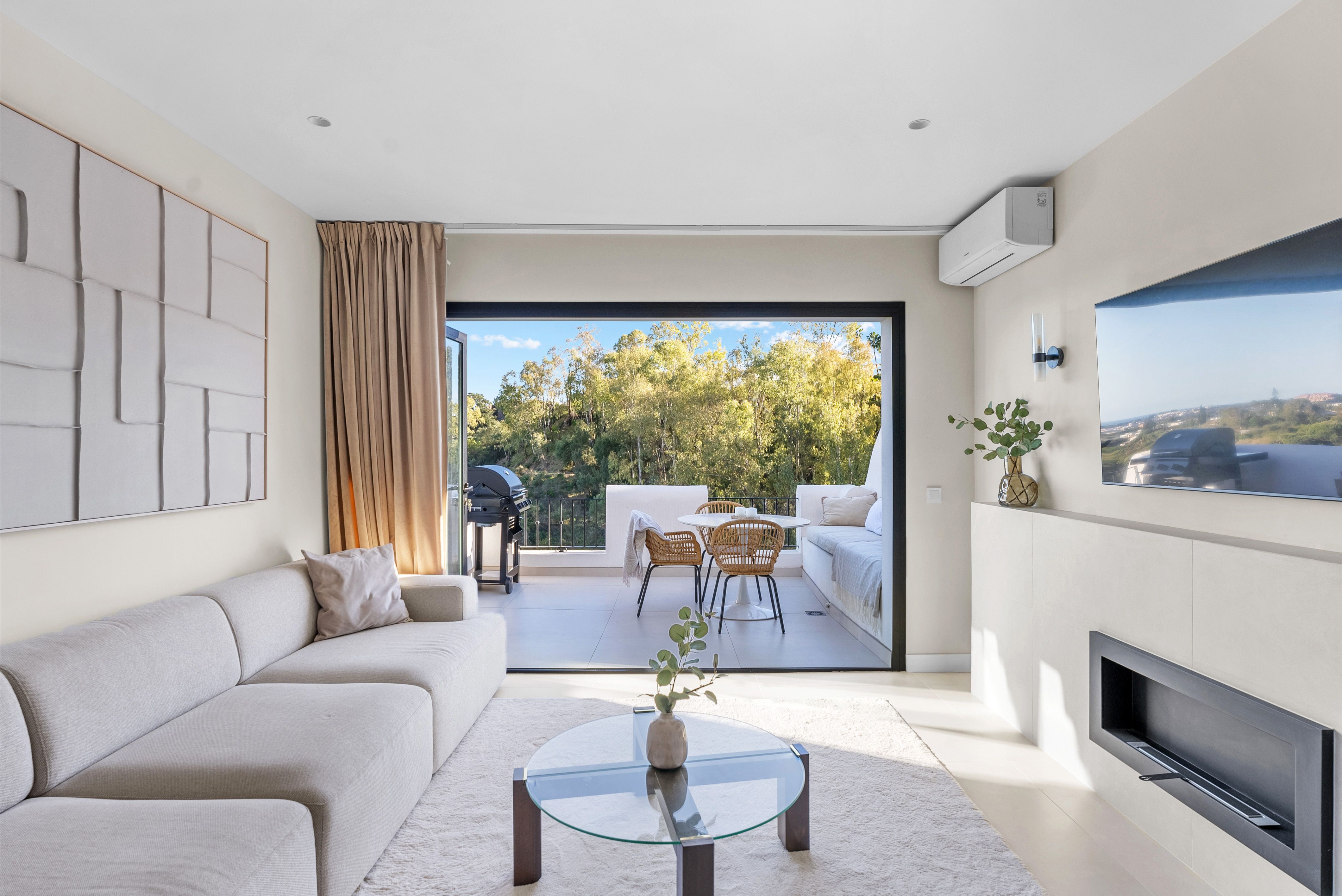 Bright open-plan living room opening to the terrace at Los Almendros 23