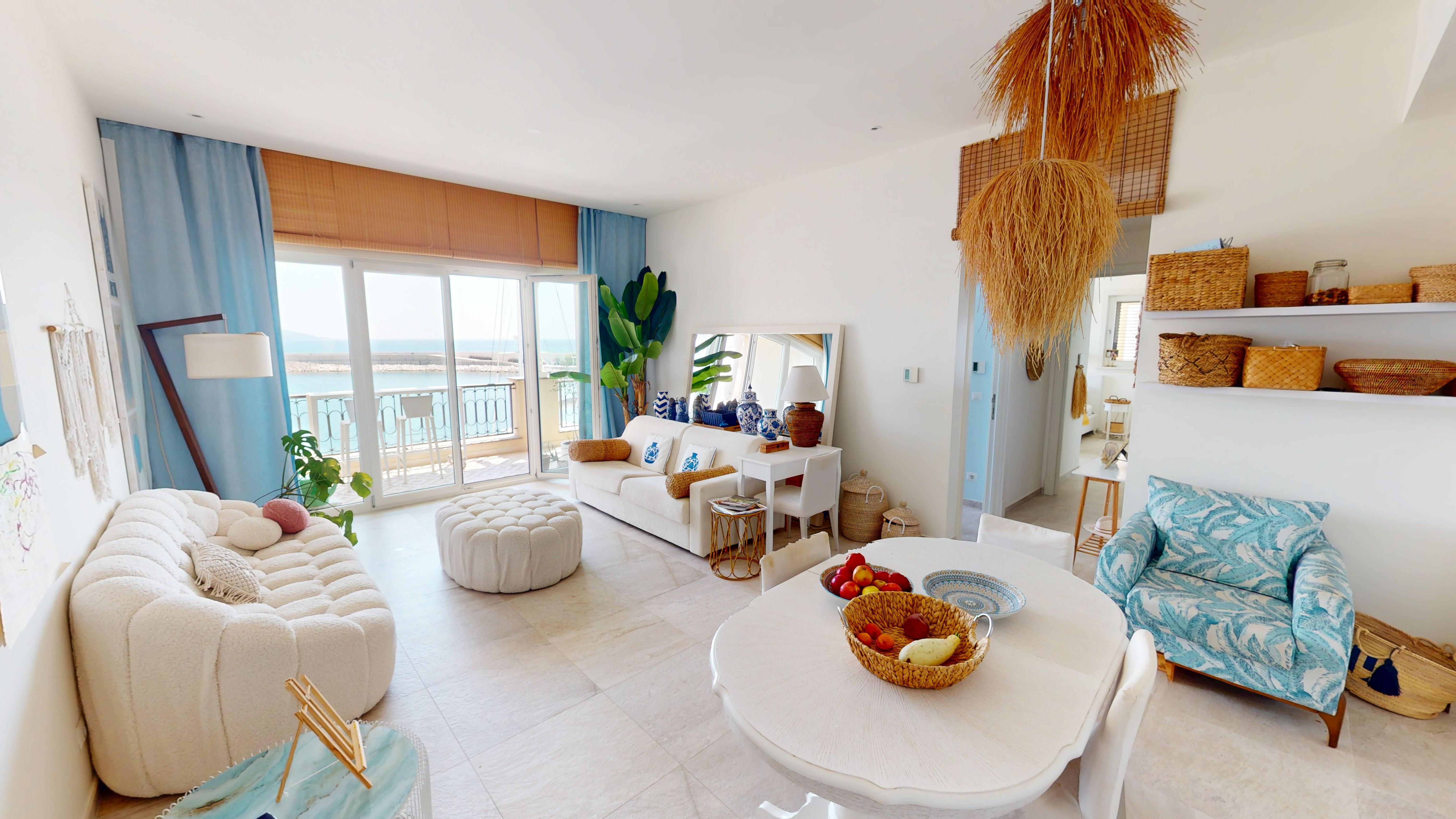 Open-plan living and dining room with marina views in Apartment B321 at Marina Village, Lustica Bay