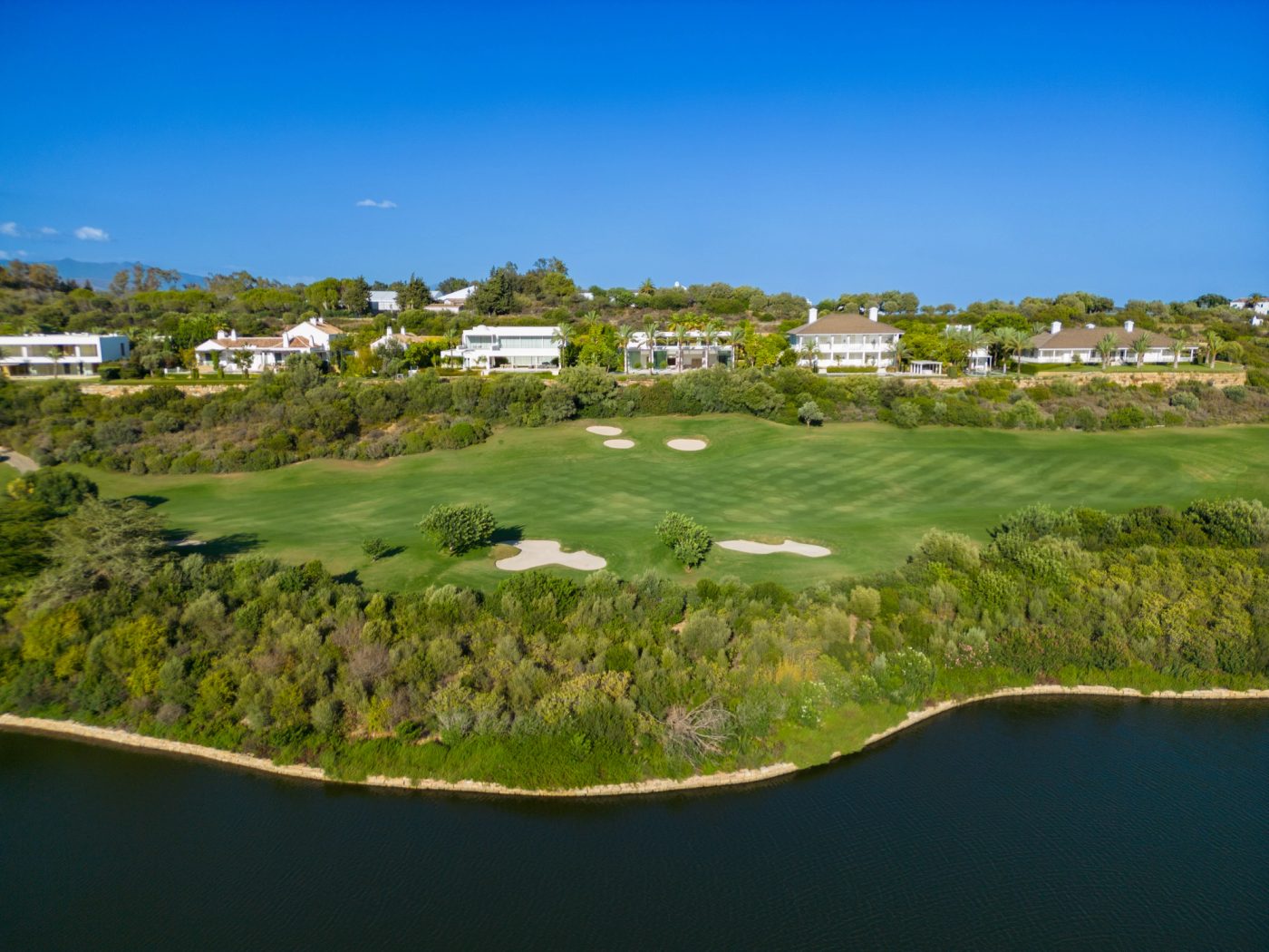 Fairway, bunkers and lake at Finca Cortesín on the Costa del Sol
