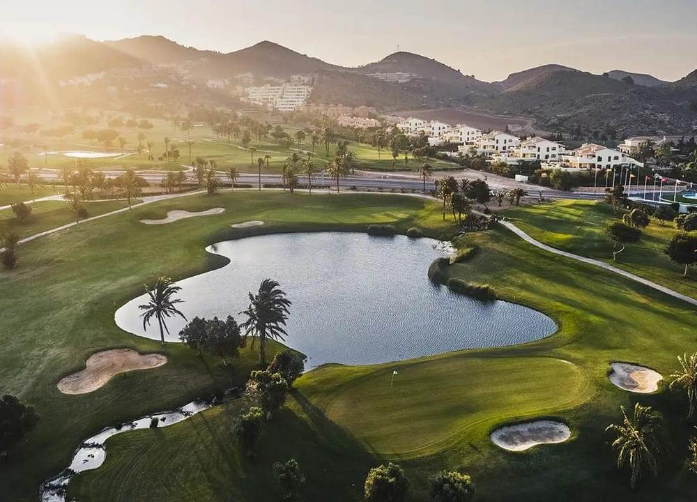 Aerial view of golf fairways and lake at La Manga Club, Murcia