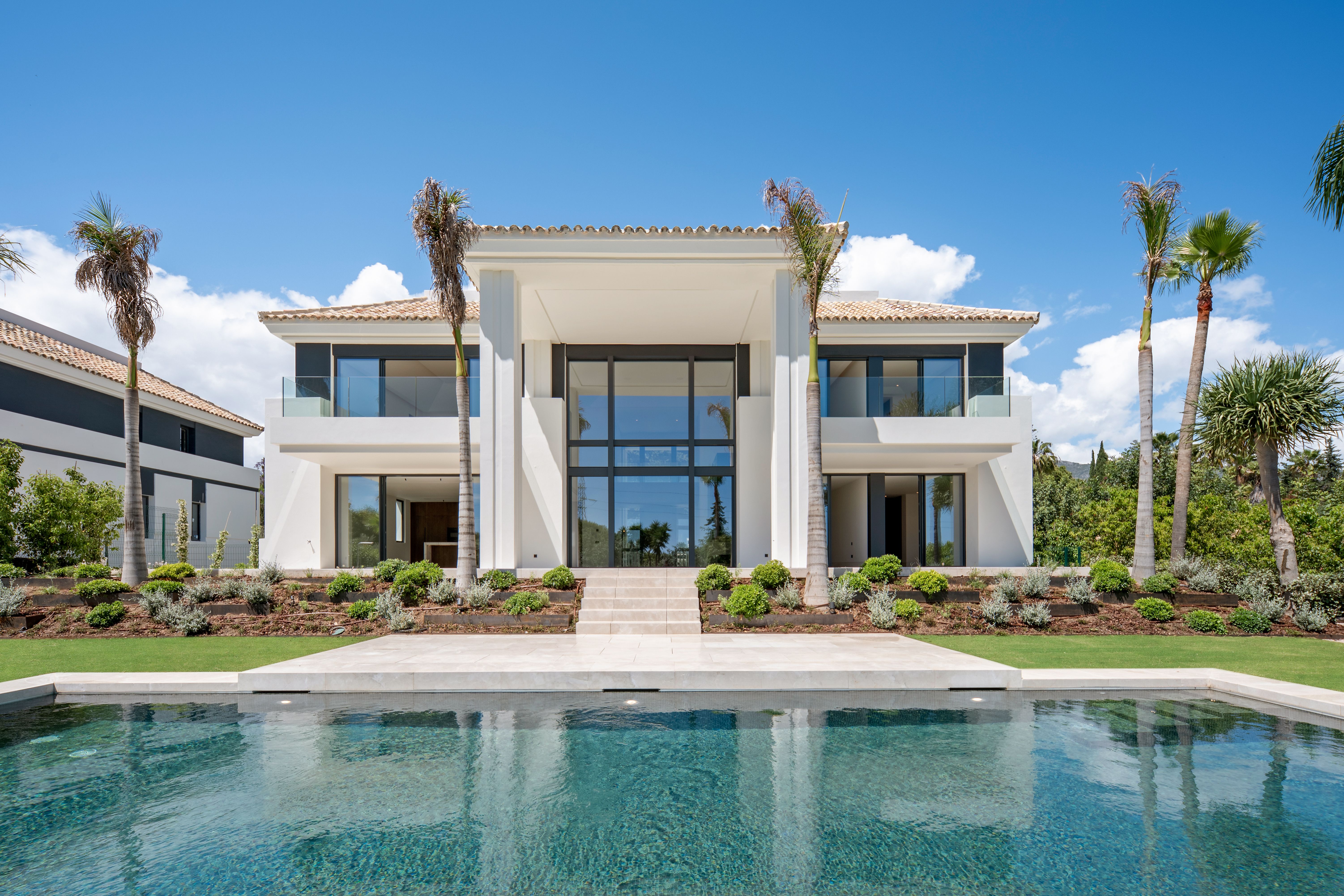 Villa Celestia exterior pool approach view in Rocío de Nagüeles