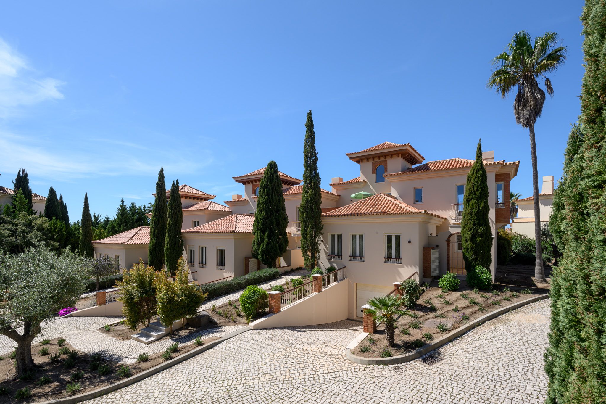 Existing linked villas within the Monte Rei Golf & Country Club landscape.