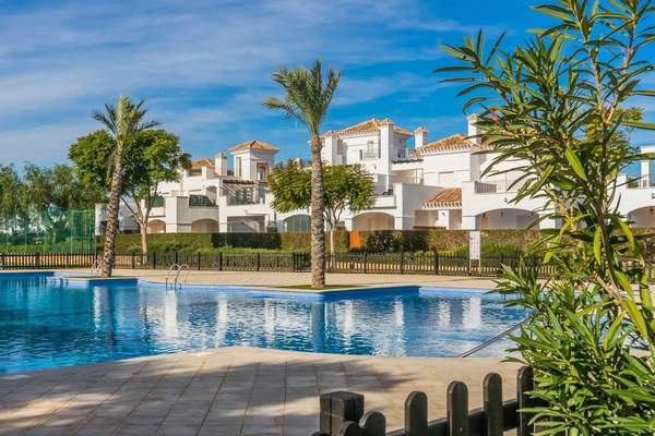 Landscaped communal swimming pool and apartment buildings