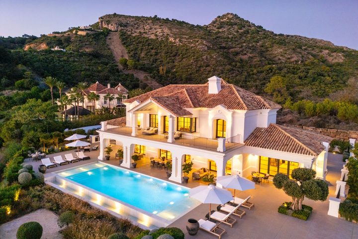 Villa Marbella at twilight with its private pool in Marbella Club Golf Resort, Benahavís