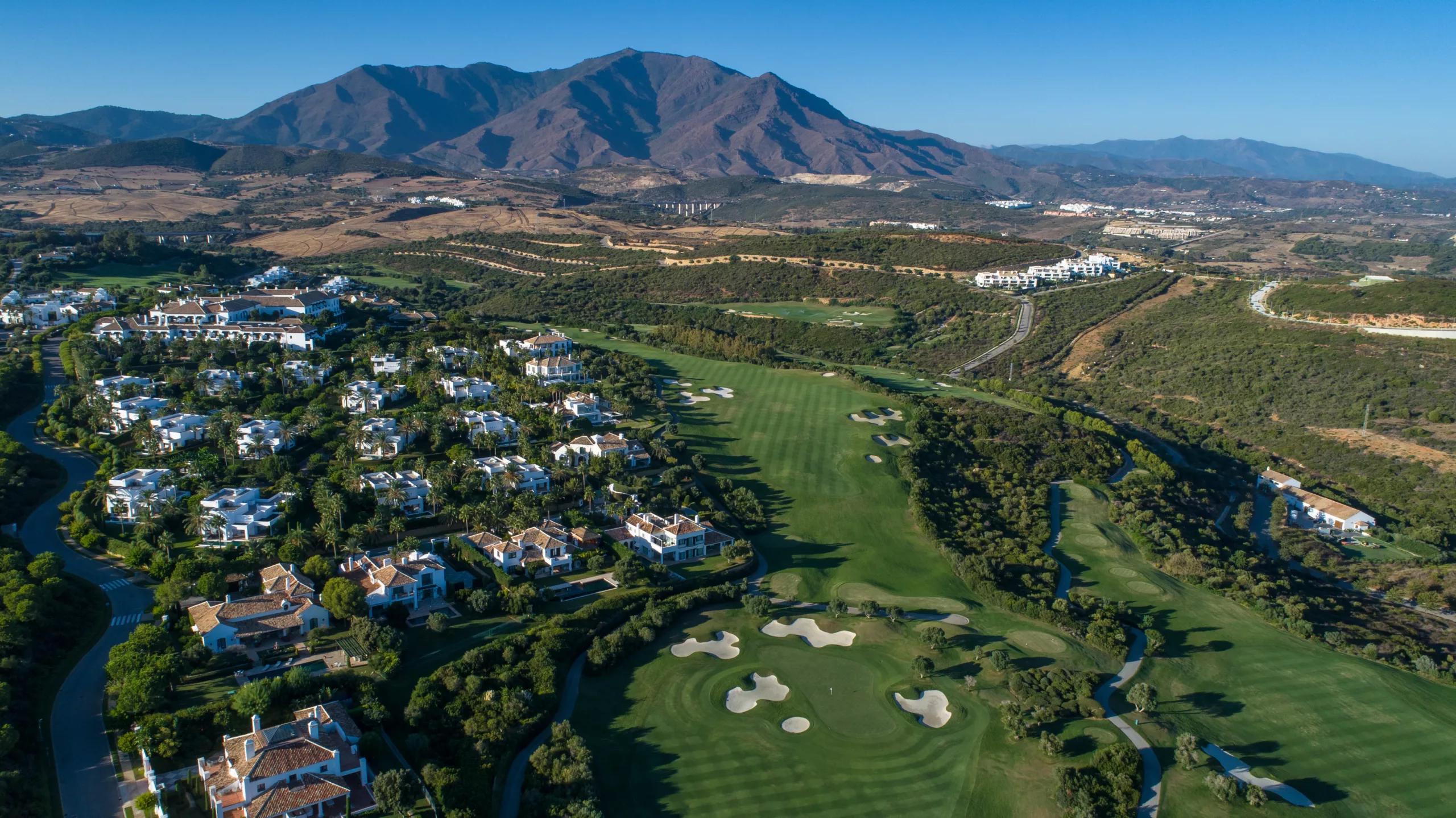 Aerial view of homes and fairways across the Finca Cortesin estate in Casares