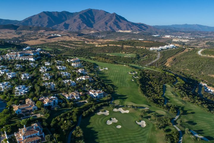 Aerial view of homes and fairways across the Finca Cortesin estate in Casares