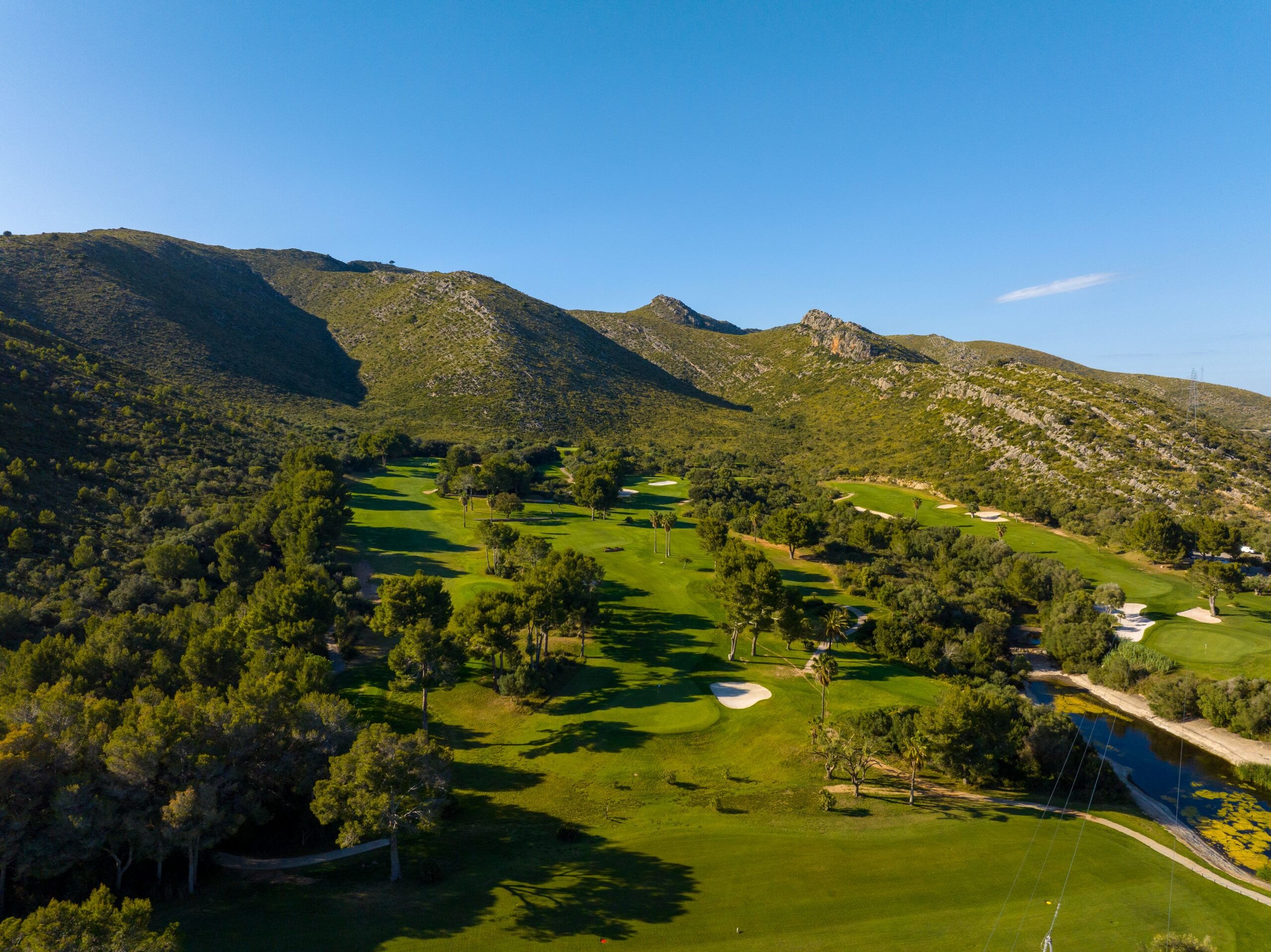 Capdepera Golf fairways and bunkers beneath the Llevant hills