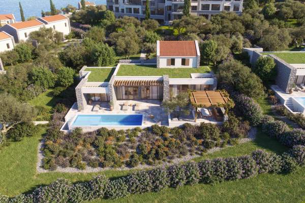 Aerial view of an individual villa with pool and landscaped plot