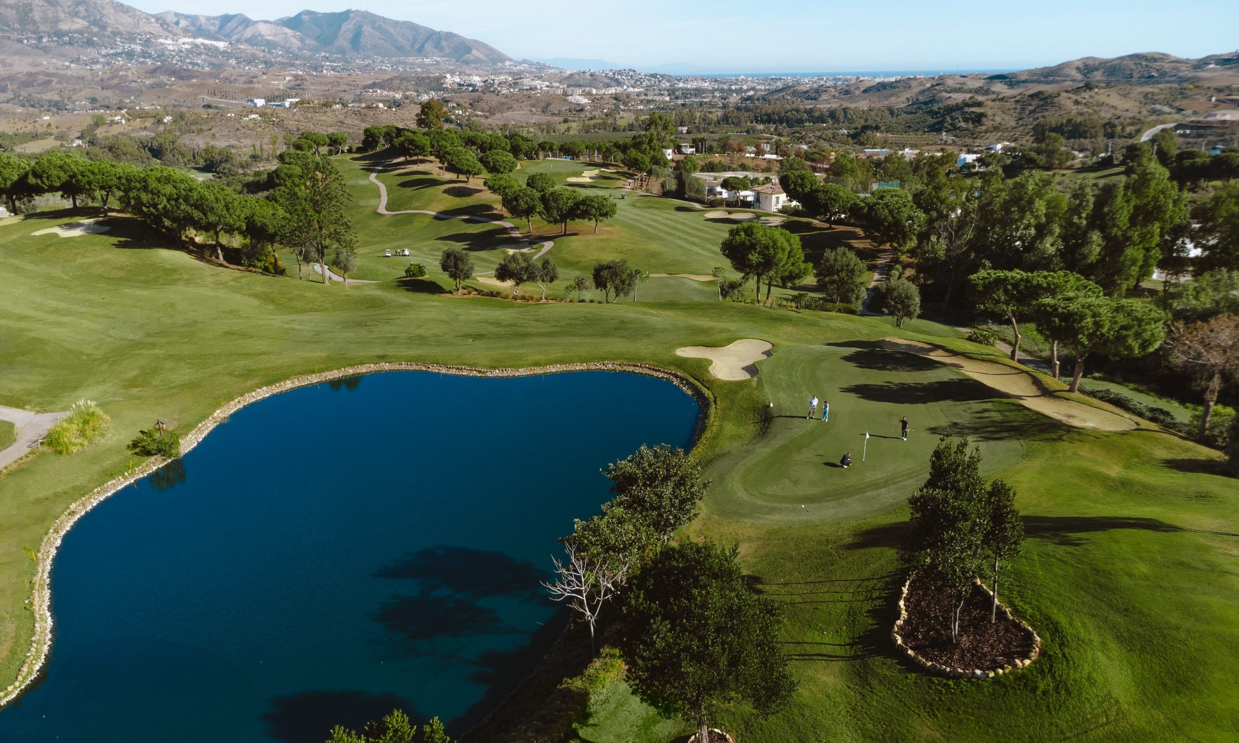 Water-lined hole and rolling fairways on La Cala Resort Campo Asia