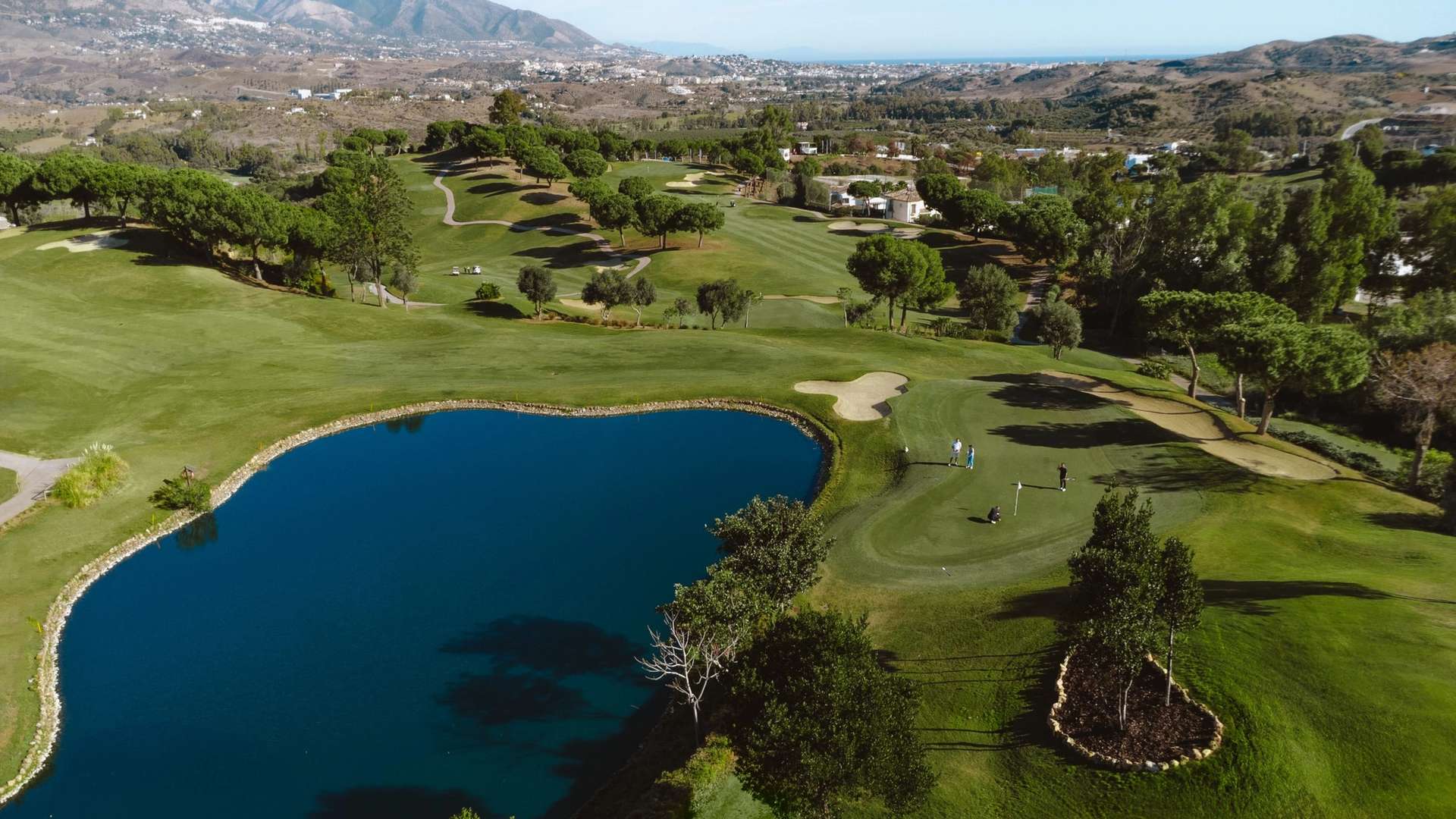 Water-lined hole and rolling fairways on La Cala Resort Campo Asia