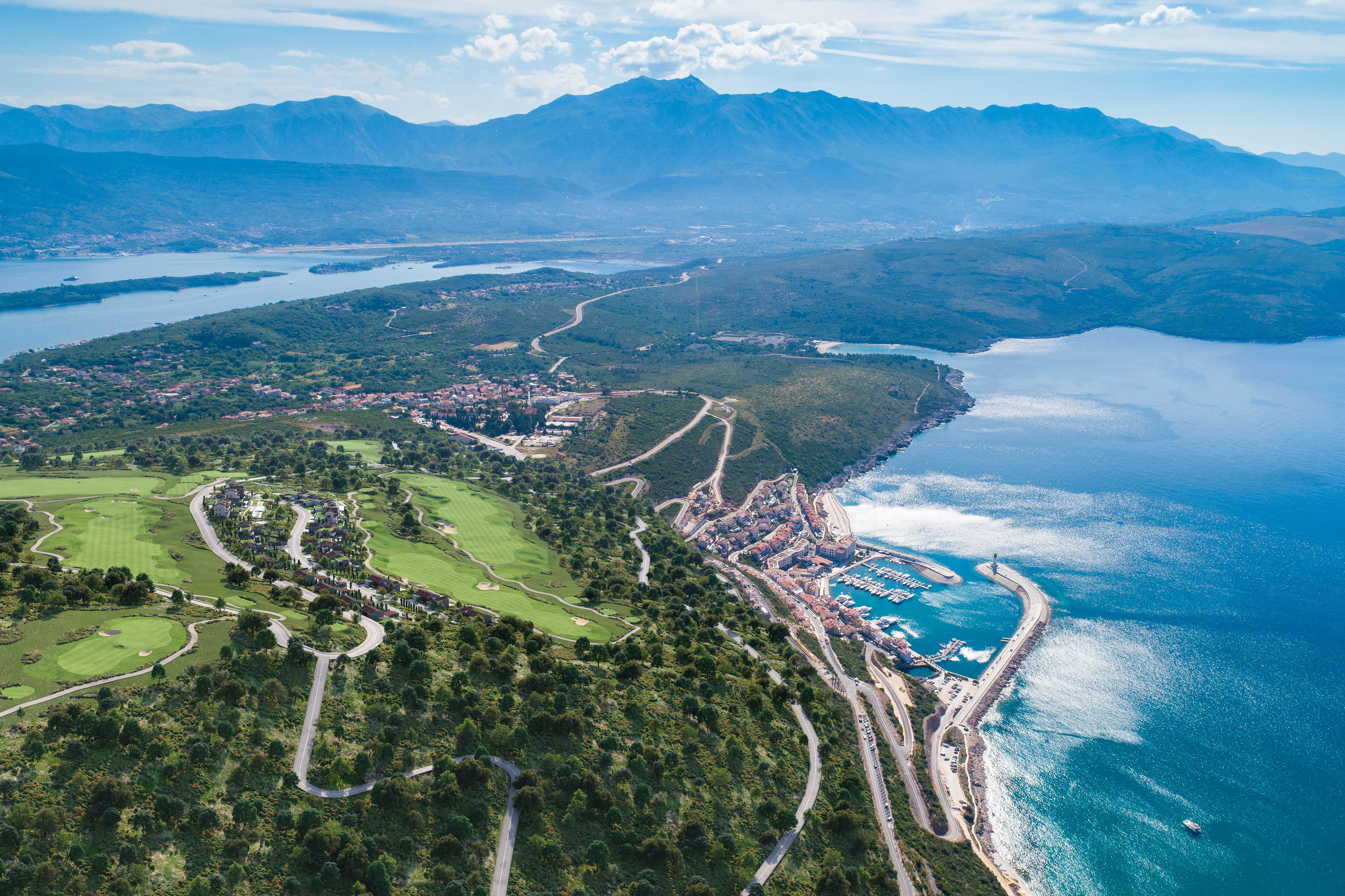 Aerial view across the Luštica Bay coastline, marina and golf landscape in Montenegro