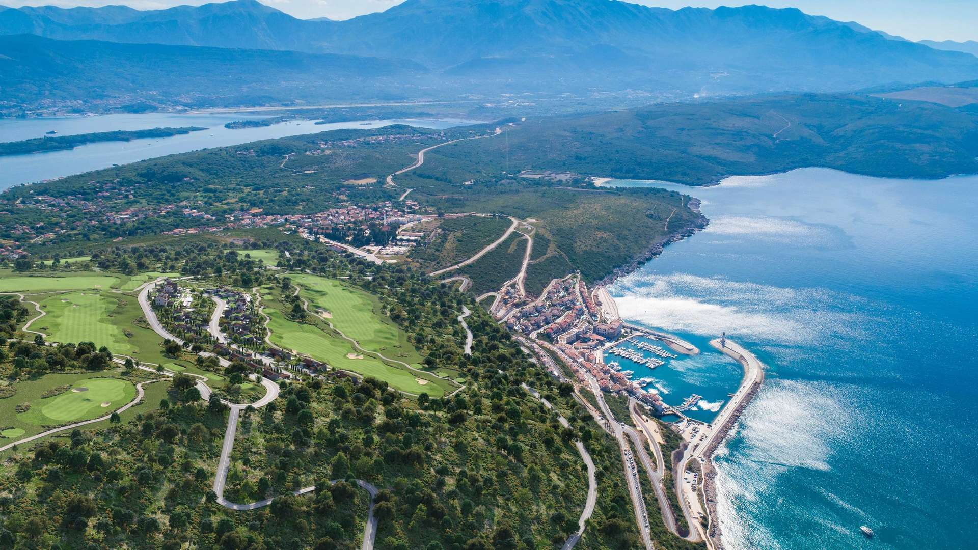 Aerial view across the Luštica Bay coastline, marina and golf landscape in Montenegro