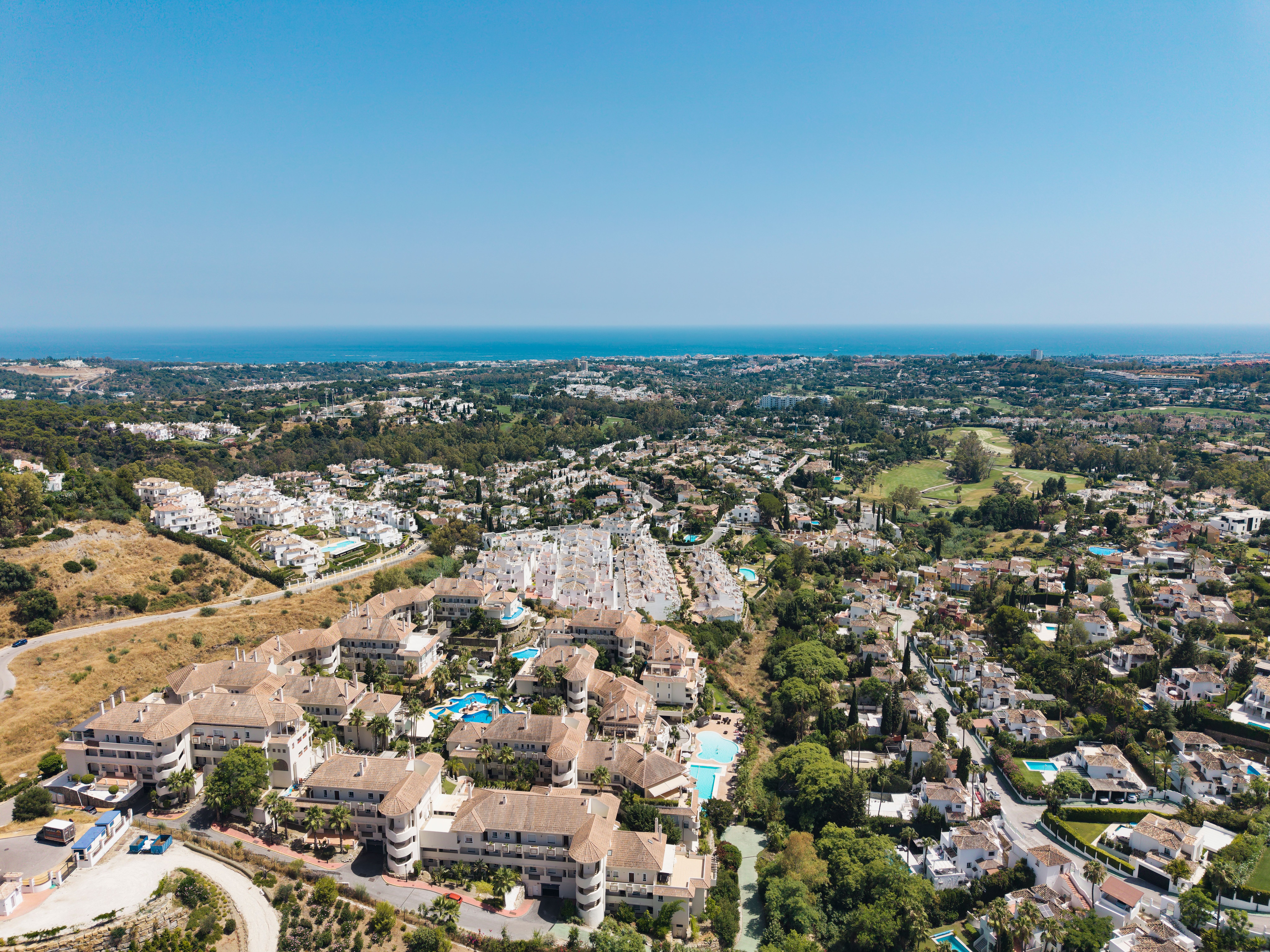 Aerial view from Aloha Hill Club towards the Mediterranean coast and surrounding landscape.