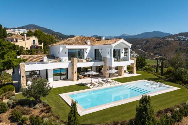 Aerial view of Villa Amara with garden, pool and hillside setting.