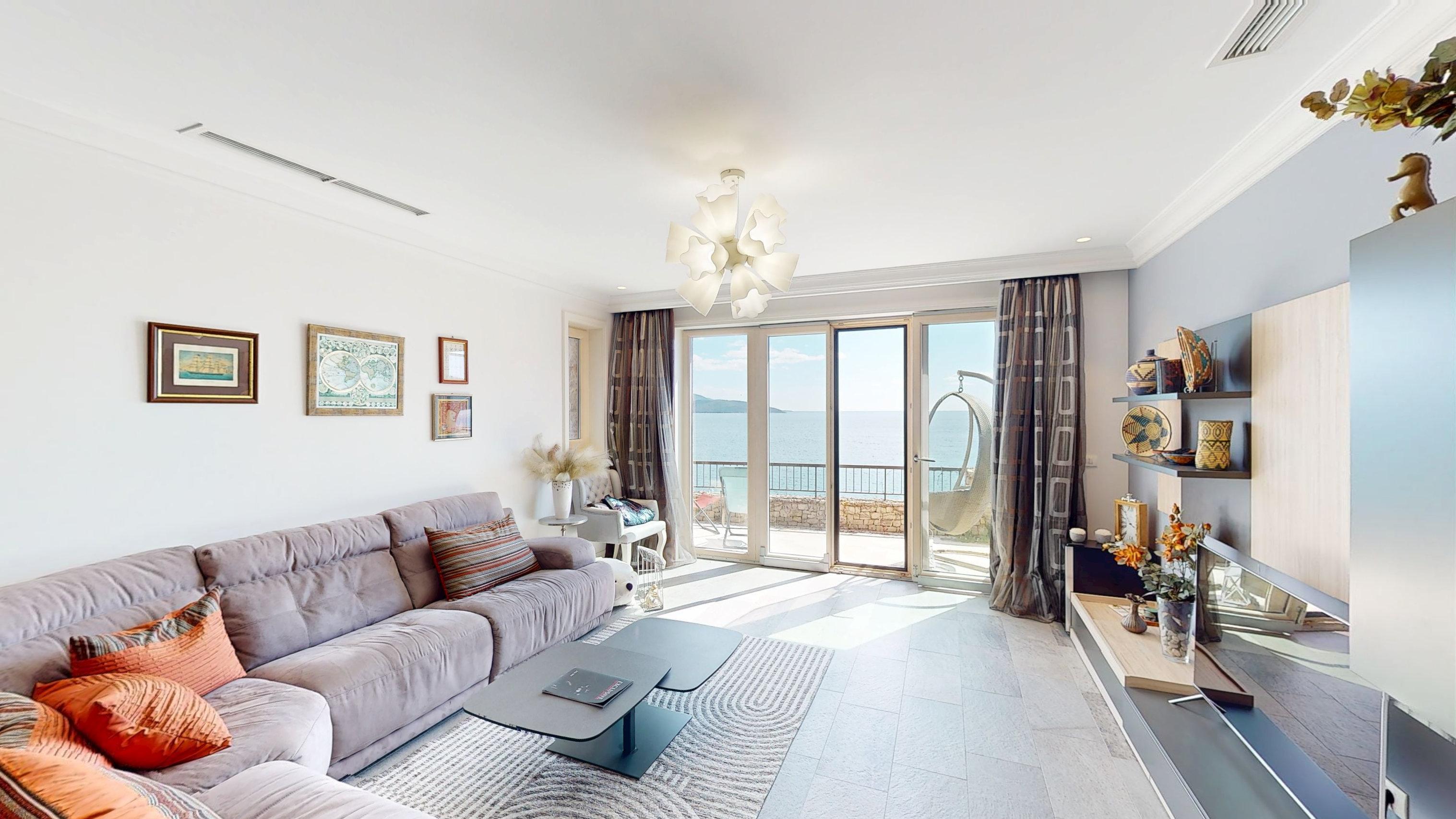 Bright principal living room opening directly to a sea-facing terrace in Apartment D302 at Marina Village, Luštica Bay